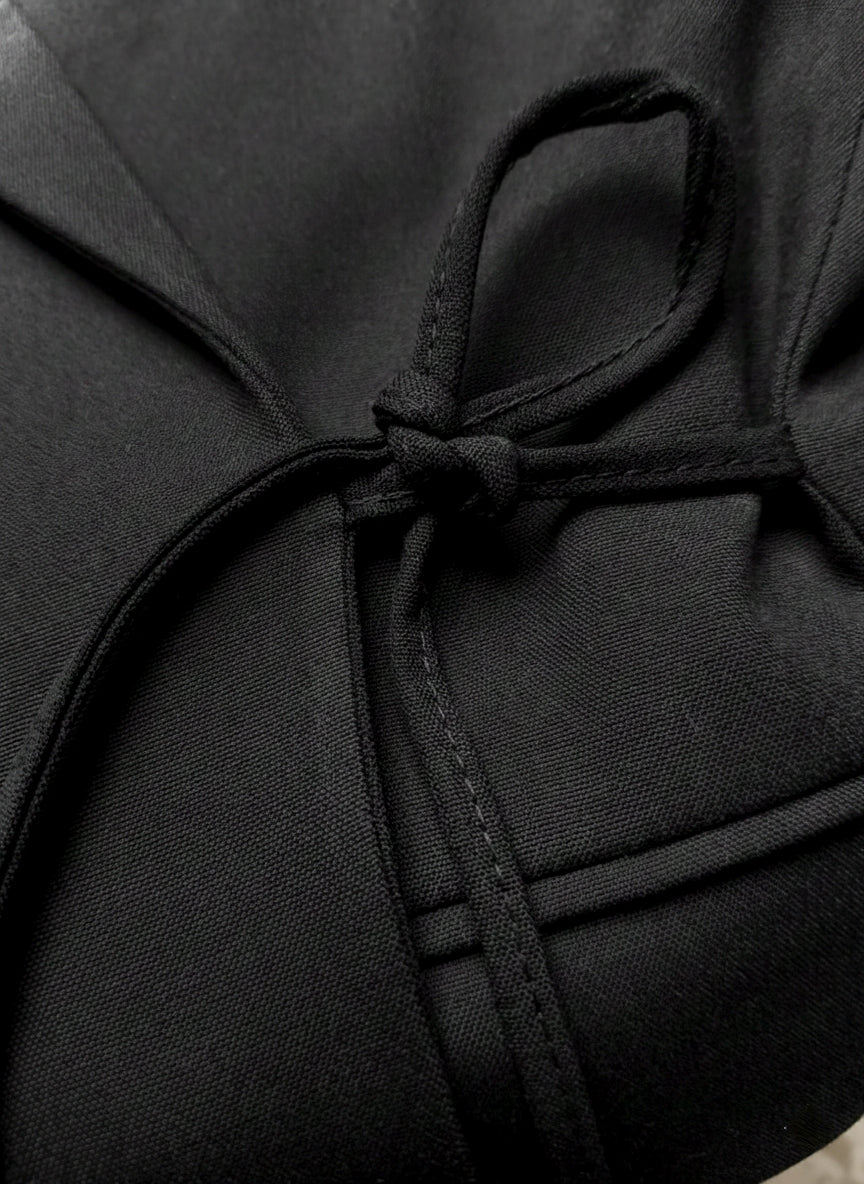 Zwarte wrap blazer met strikdetail